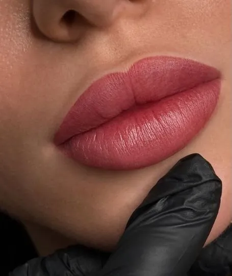 Close-up of lips with soft rose lip blush color